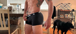 WAMA men’s hemp trunks in black on model, side view