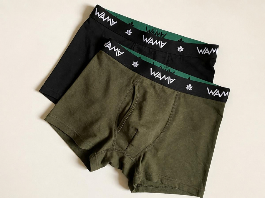 Two pairs of WAMA hemp boxer briefs, one black and one olive, laid flat