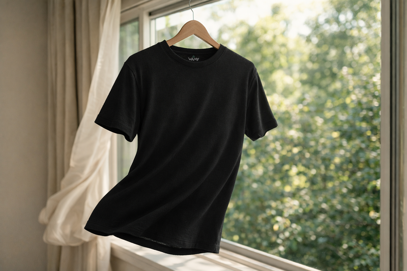 Black Hemp Crew Neck T-Shirt hanging by a window