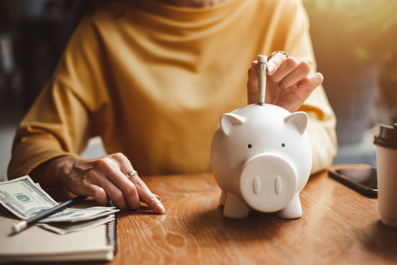 A girl saving money in a piggy bank, highlighting a deal on premium hemp underwear and a bralette.