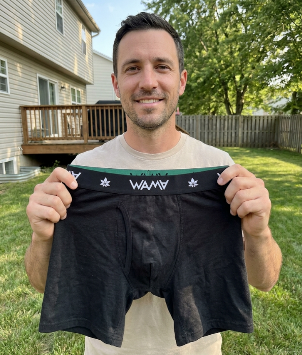 Man holding WAMA hemp boxer briefs