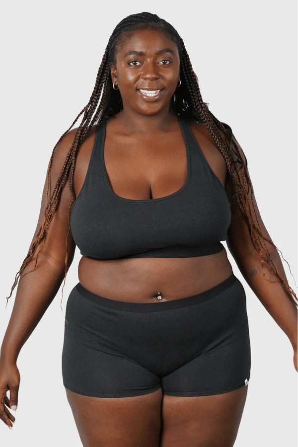 Full body view of Hemp Boy Shorts underwear in black on model wearing size 2XL, 5'8" dress size 14