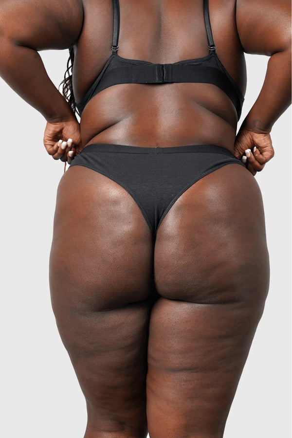 Back view of Hemp Thong underwear in black on model wearing size 2XL, 5'8" dress size 14