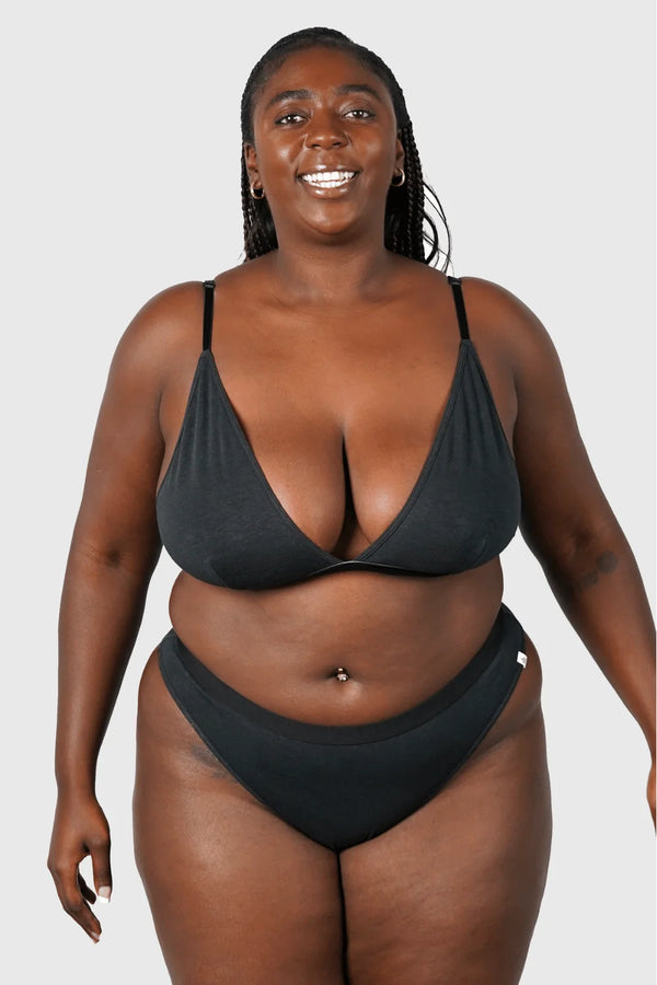 Full body view of Hemp Thong underwear in black on model wearing size 2XL, 5'8" dress size 14