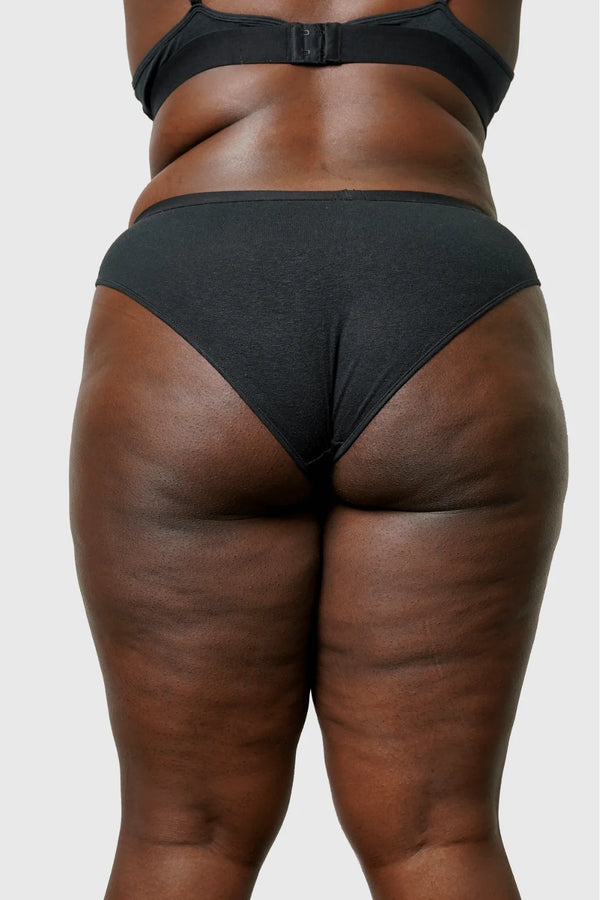 Back view of Hemp Bikini in Black on model wearing size 2XL, 5'8” dress size 14