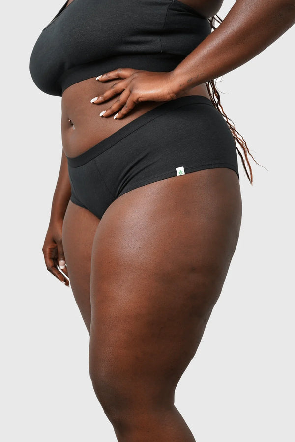 Side view of Hemp Hipster Panties in Black on model Jakarra wearing size 2XL, 5'8 dress size 14