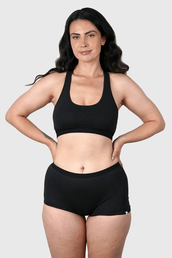 Full-body view of Hemp Boy Shorts in Black on model wearing size M, 5'10” dress size 6