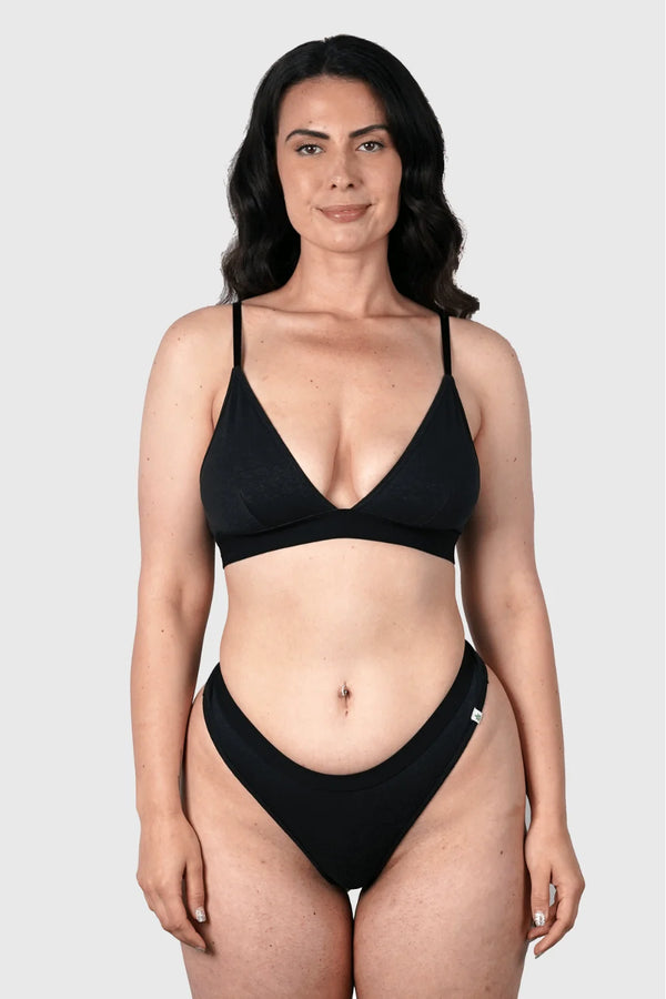 Full-body view of Hemp Thongs in Black on model wearing size M, Jess is 5'10" dress size 6