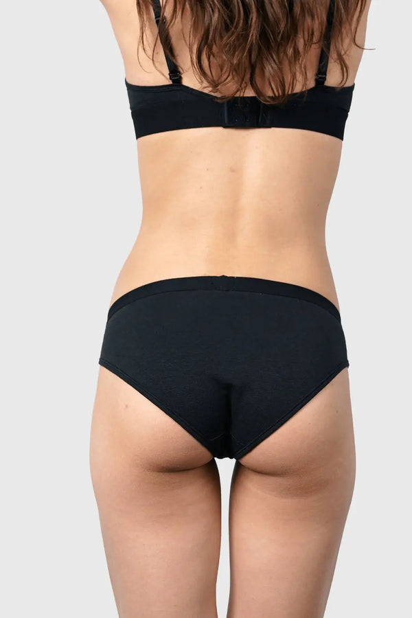 Back view of Hemp Bikini in Black on model wearing size S, 5'10” dress size 2