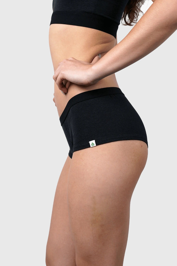 Side view of Hemp Hipster Panties in Black on model wearing size S (5'10", dress size 2)