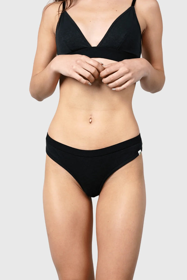 Front view of Hemp Thong underwear in black on model wearing size S, 5'10" dress size 2